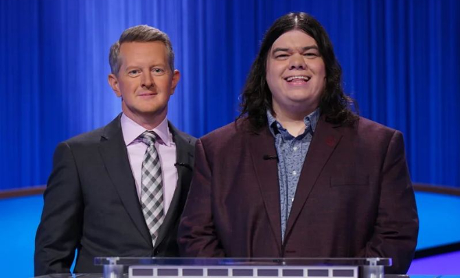 Evan Jones pictured with the Jeopardy host Ken Jennings.